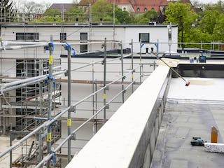 Massivhaus ALFA Mehrfamilienhaus M1 von Dennert Massivhaus - Mehrfamilien-, Reihen- & Doppelhaus, Cubushaus Außenansicht 3