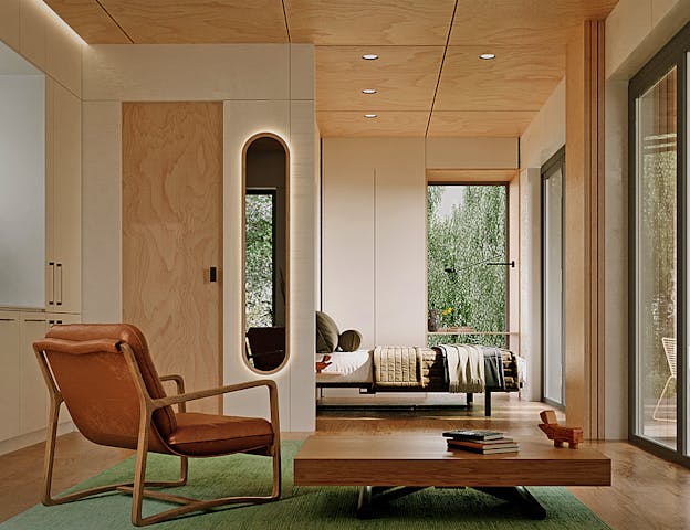 Offener Wohnraum mit Schlafbereich im Tiny House von Dwellii House