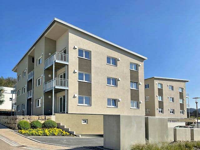 Fertighaus Mehrfamilienhaus in Oberrot von Fertighaus WEISS - Mehrfamilienhäuser, Pultdachhaus Außenansicht 2