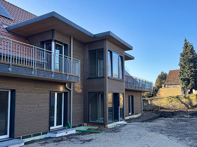 Fertighaus Mehrfamilienhaus mit sieben Wohneinheiten von Frammelsberger Holzbau - Mehrfamilienhäuser, Außenansicht 2