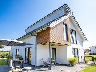 Fertighaus Versetztes Pultdach in Wellingholzhausen von Hausbau Heggemann Schlüsselfertig ab 450000€, Außenansicht 1