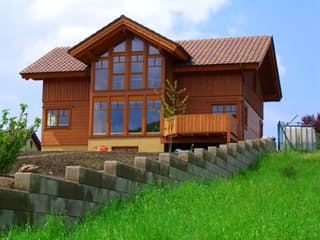 Fertighaus Hochkönig von TIROLIA Ausbauhaus ab 142962€, Blockhaus Außenansicht 1