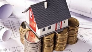 Modellhaus auf Geld
