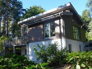 Fertighaus Johnsen - Haus 1 von Johnsen Zimmerei & Hausbau Schlüsselfertig ab 349000€, Pultdachhaus Außenansicht 1