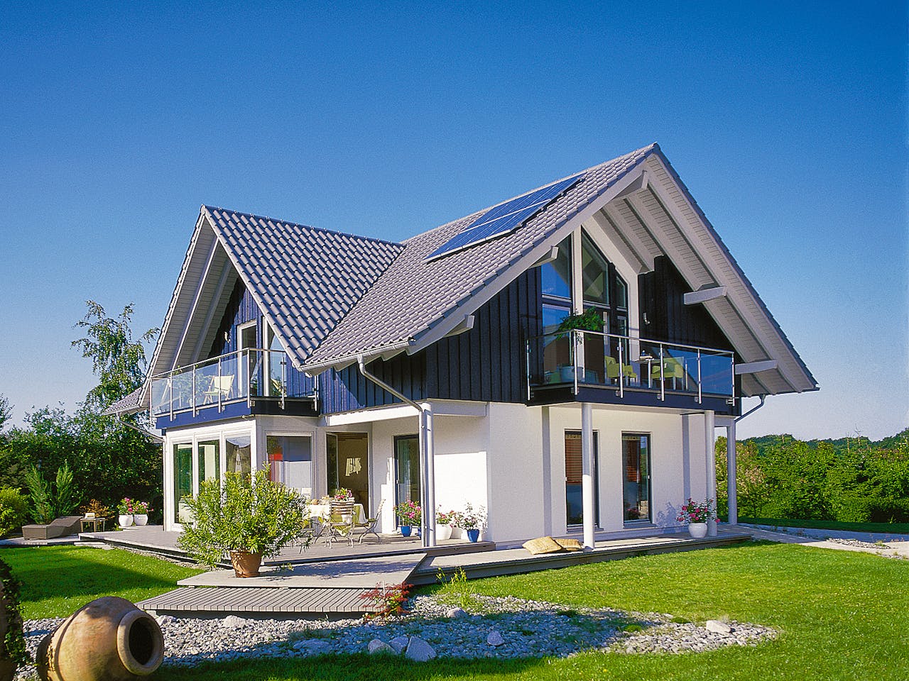 Fertighaus E 15-205.1 - Haus mit Wintergarten von SchwörerHaus Schlüsselfertig ab 576747€, Außenansicht 1