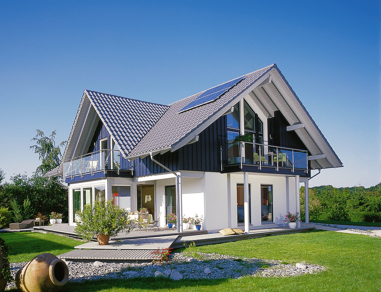 Fertighaus E 15-205.1 - Haus mit Wintergarten von SchwörerHaus Schlüsselfertig ab 566550€, Außenansicht 1