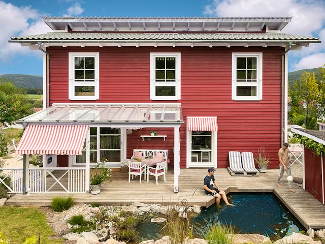 Fertighaus E 20-168.1 - Fertighaus im skandinavischen Landhausstil & Hampton-Flair von SchwörerHaus, Außenansicht 3