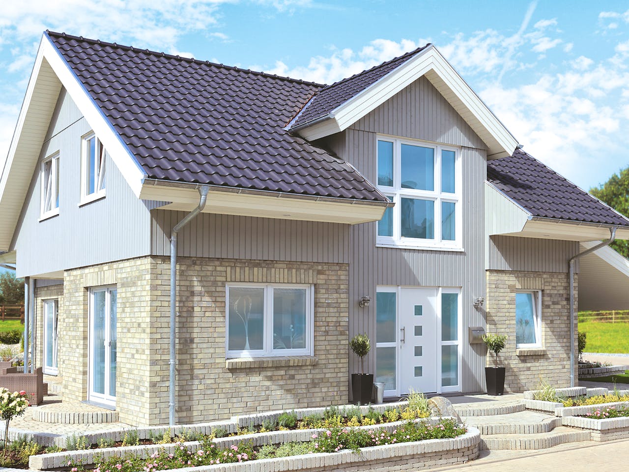 Fertighaus Westerland - Winkelhaus im Landhausstil von Danhaus Deutschland Schlüsselfertig ab 474901€, Außenansicht 1