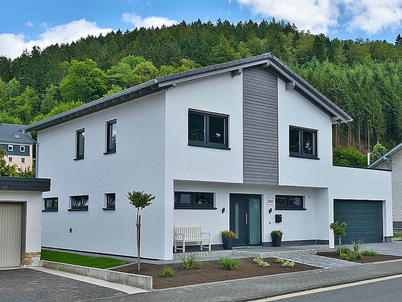 Fertighaus Haus Nübold-Bracht von Wiese und Heckmann, Satteldach-Klassiker Außenansicht 1